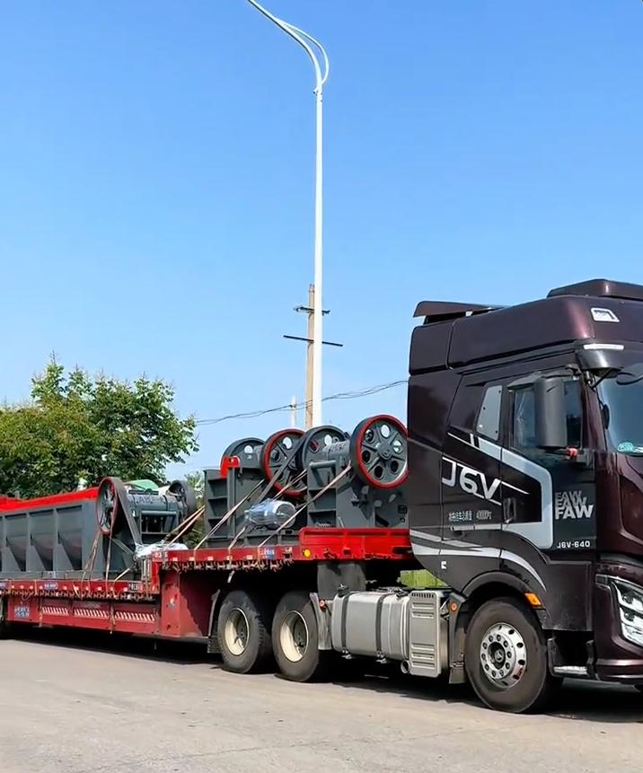 Complete crushing plant equipment loaded on 4 trucks for shipment to customer project site